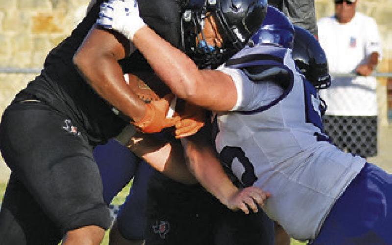 SOMERVILLE FIGHTS FOR some tough yardage against Leon last Friday, Aug. 14, in a scrimmage in Somerville. Tribune photo by Roy Sanders
