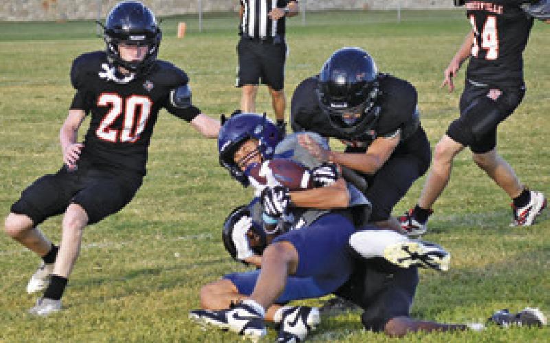 THE SOMERVILLE DEFENSE makes a tackle against Leon in a Friday, Aug. 14, scrimmage in Somerville. Tribune photo by Roy Sanders