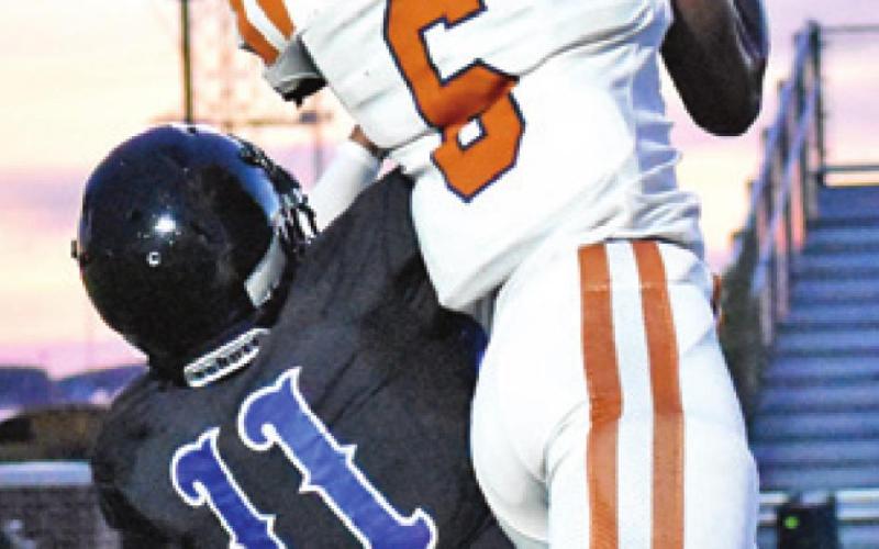 CALDWELL’S TRE Burns goes for the ball. -- Tribune photo by Roy Sanders