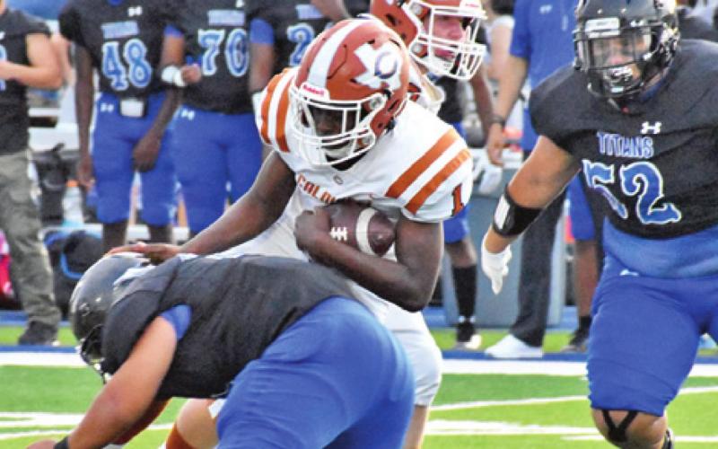 JAMAR HEWITT CARRIES the ball for Caldwell in the opener.