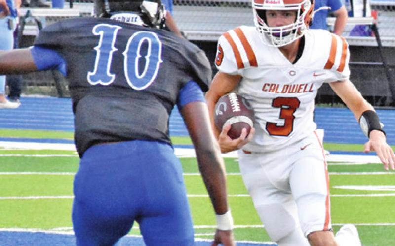 QUARTERBACK RYAN SHUPAK carries against Manor New Tech.