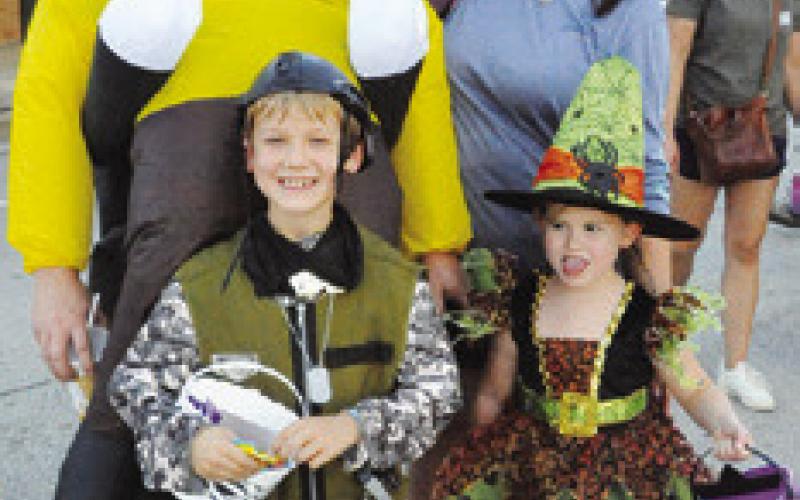 THE EVANS FAMILY was dressed in costume, enjoying Saturday’s Scare on the Square. (And, yes, Samantha is in costume...as “Mom.”) Tribune photo by Denise Squier
