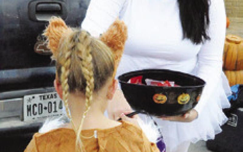 ANGELS WERE SWEET giving out candy to children at last Saturday’s Scare on the Square in downtown Caldwell. Tribune photo by Denise Squier