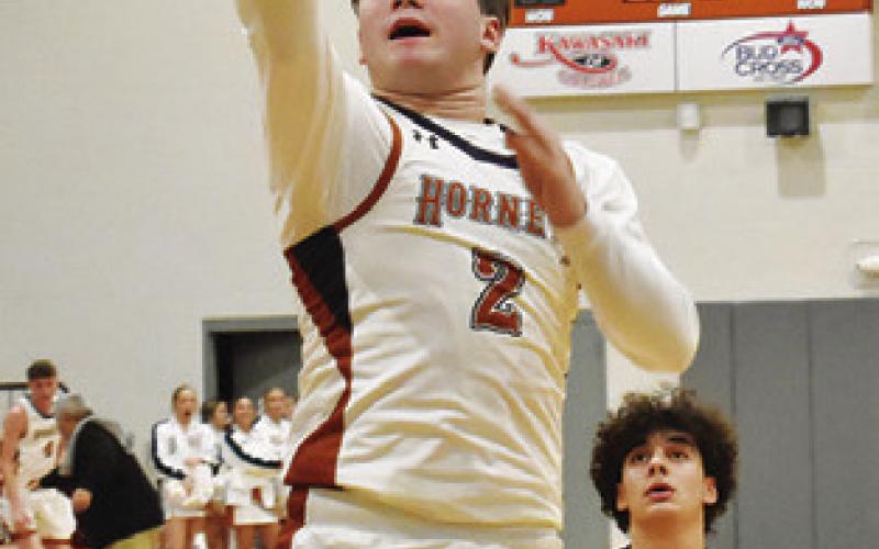 JAMIN WHITE of Caldwell takes a shot against Giddings. Caldwell won 55-34.