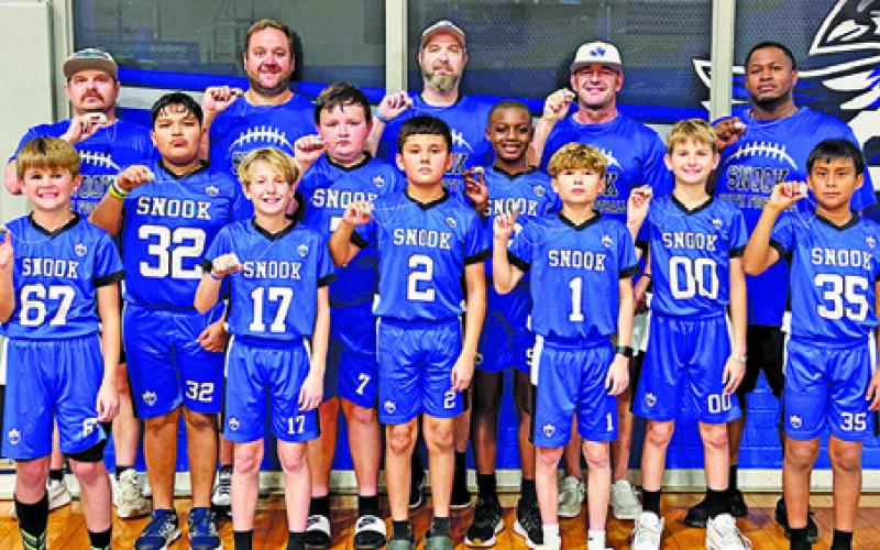 THE SNOOK DIVISION 3 flag football team recently won the 2025 Division 3 championship by defeating Somerville 13-12 in the title game. The championship team includes, from left, front, Zachary Giesenschlag, Gus Giesenschlag, Adan Rico, DJ Cotton, Grayson Giesenschlag, Noe Sierra, middle, Jose Vasquez, Jase Hruska, Cornell Curry, back, Coach Derek Cotton, Coach RJ Giesenschlag, Coach Wade Giesenschlag, Coach Justin Hruska and Coach Cornell Corry.
