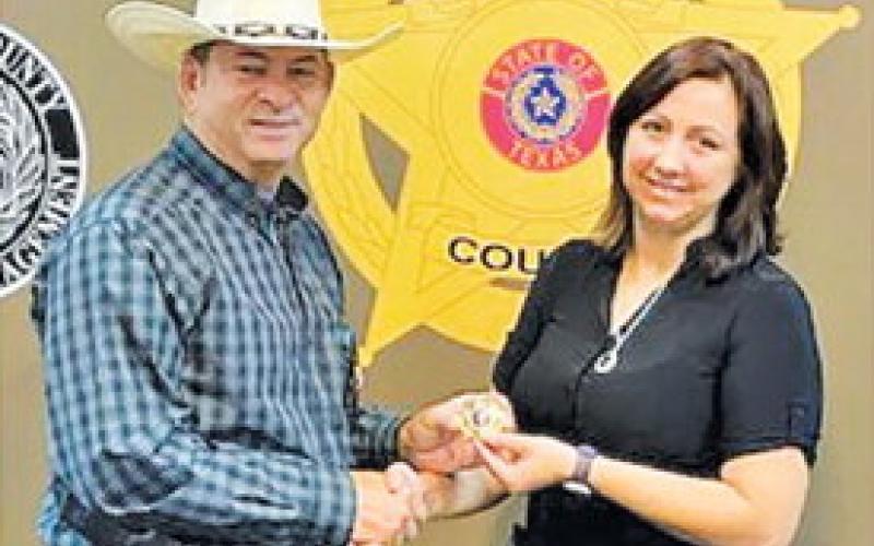 STEPHANIE SMITH WAS recently promoted to investigator at the Burleson County Sheriff’s Office. She is pictured with Chief Deputy Bill Rios.