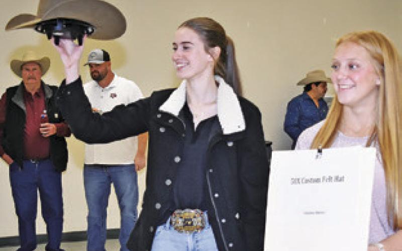 MARY HANCOCK and Caitlyn Faust display these auction items at the 2025 Burleson County Go Texan annual fundraiser. This year’s event is set for this Saturday, Feb. 7.