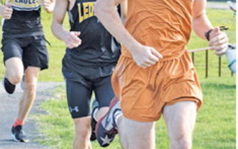WILL MCDONALD runs during the varsity boys’ 5k race at last Saturday’s Caldwell Cross Country Invitational at Davidson Creek Park.