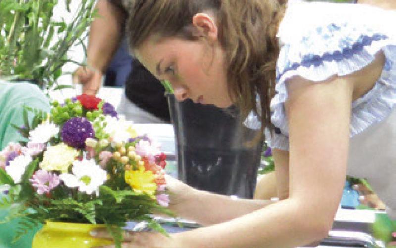 HIGH SCHOOL FLORAL design students from across the state were at the Caldwell Civic Center on Tuesday for the Young Florists of Texas Competition creating arrangements with cut flowers. Tribune photo by Denise Squier