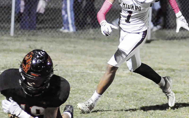 GAGE TUCK of Somerville goes for the ball against Milano in a 49-6 home victory. Tribune photo by Denise Squier