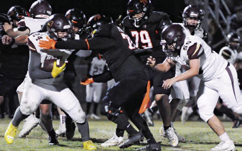 SOMERVILLE’S IZAEL GARZA and Sabino Vasquez move in for a tackle last Friday against Milano in Somerville. Tribune photo by Denise Squier