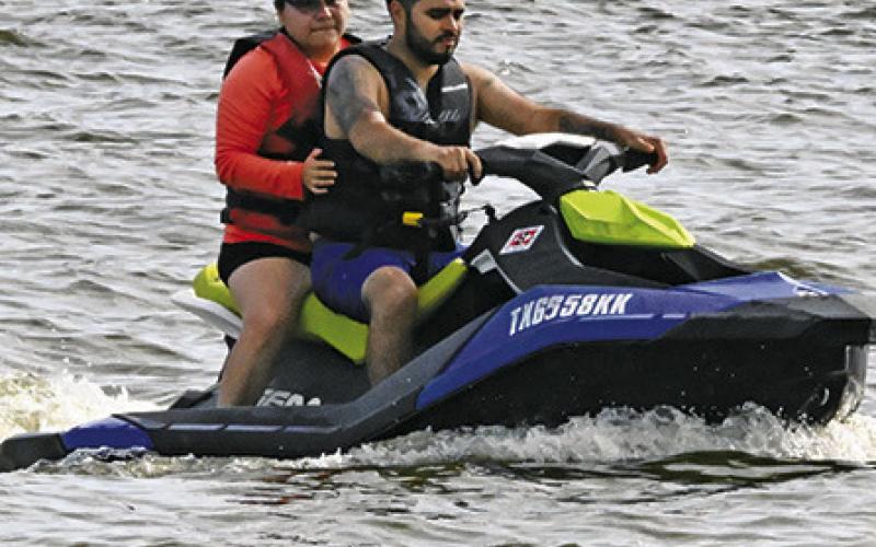 PEOPLE ENJOYED riding Jet Skis on Lake Somerville on July 4. Tribune photo by Denise Squier
