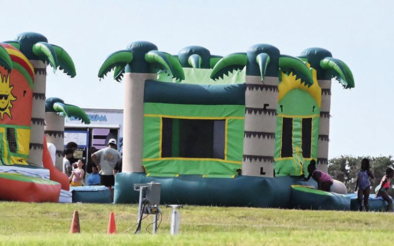 CHILDREN OF ALL AGES ENJOYED water slides and bounce houses at Welch Park on Saturday, July 4, as part of the Welch Park July 4th Celebration. Tribune photo by Denise Squier
