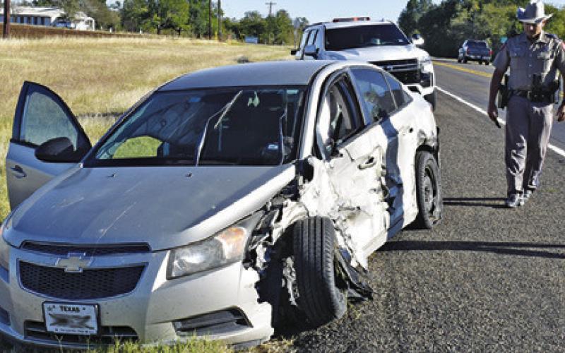 A DPS TROOPER investigates at the scene of this accident on Oct. 30 on State Highway 36 North near County Road 314.
