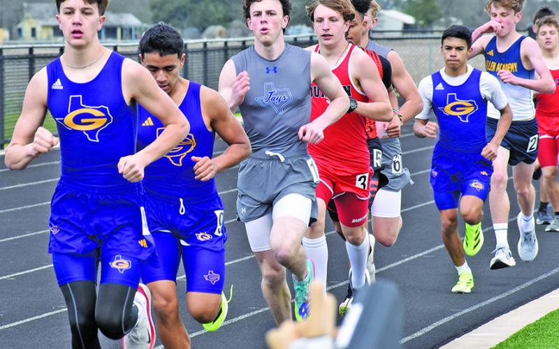SNOOK’S ETHAN JANAC (CENTER) runs during a long distance race at last week’s Bluejay Relays in Snook. Tribune photo by Roy Sanders