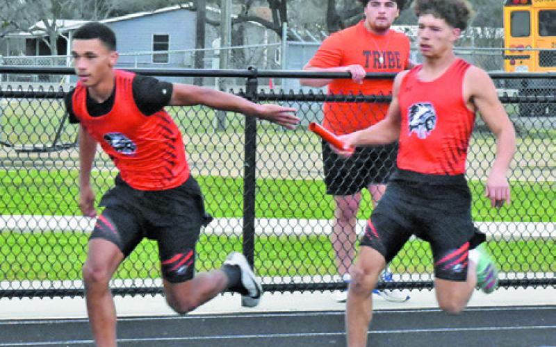 SOMERVILLE’S JI’ALLE DEERE receives the baton from Jayden Young during a boys relay race at the Bluejay Relays on Thursday. Also pictured is Moses Stickel looking on. Tribune photo by Roy Sanders