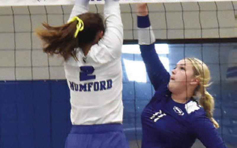AUBREY BECKER hits the ball over a Mumford blocker during the Lady Jays’ 9-25, 13-25, 17-25 loss to the Lady Mustangs. Tribune photo by Roy Sanders