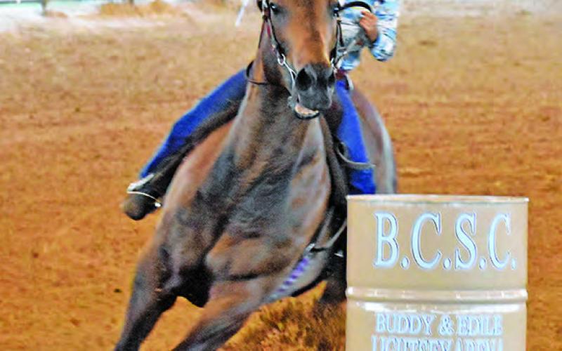 GIULIANA SCARMARDO COMPETES in the 9U Straight Barrels at the Burleson County Saddle Club Youth Rodeo in Caldwell.