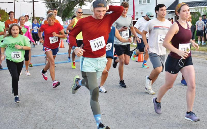 CALDWELL’S GARRETT SCOTT (bib number 4341) and runners from across Texas run in last Saturday’s Kolache Krunch 5K. Scott finished second in the male 15-19 division. -- Tribune photo by Roy Sanders