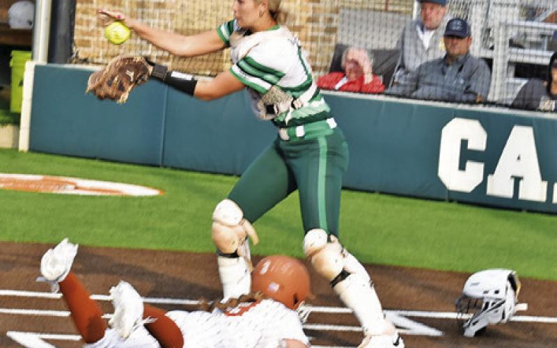 CALDWELL’S AVERY SMITH slides into home during the Lady Hornets’ warm-up game against Latexo last Friday night.