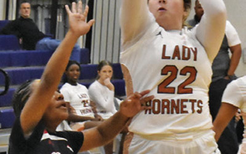 HANNAH RAE CLARK shoots during the recent Caldwell-Burton game at Hornet Gym. Tribune photo by Roy Sanders