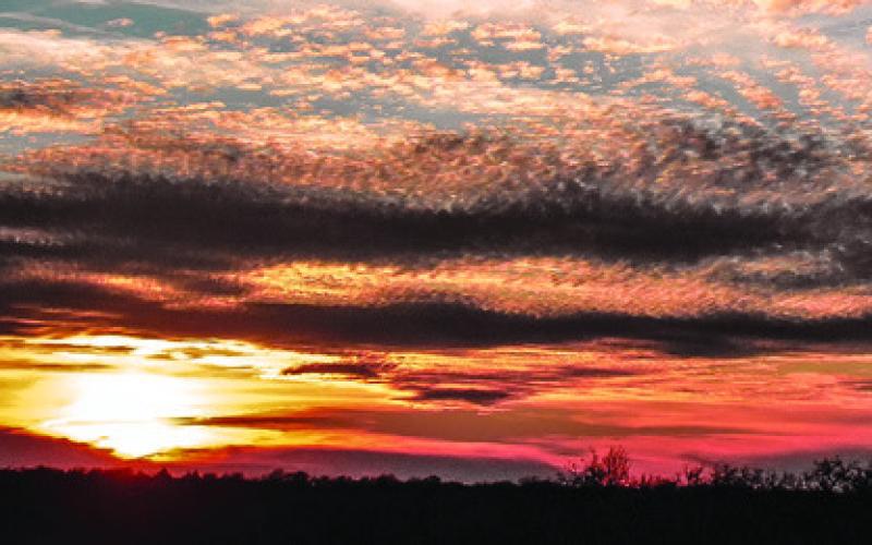 THIS SUNSET WAS visible on Sunday, Jan. 4, off County Road 333 in Burleson County. Tribune photo by Roy Sanders