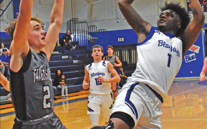 SNOOK’S KALEB CARROLL leans back to take this shot against Fayetteville. The Bluejays lost 59-54. -- Tribune photo by Roy Sanders
