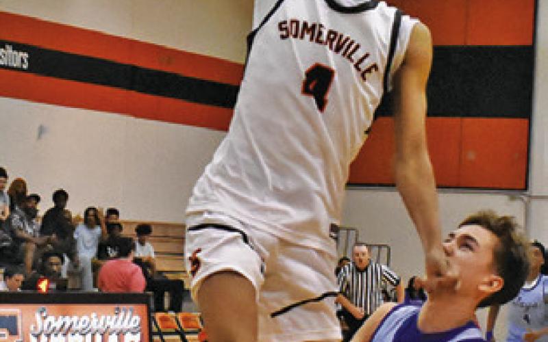 KEVIN GAINES of Somerville takes a shot as Snook’s Zander Sodolak defends.