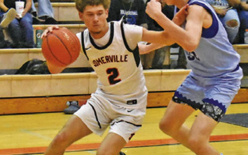 JAYDEN YOUNG of Somerville dribbles the ball around Snook’s Zander Sodolak.