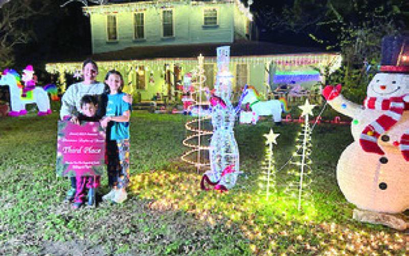 THE THIRD PLACE residence winner of the Snook EEA Christmas Lights of Snook was the Hardin Family, with their variety of Santa’s, snowmen, decorated trees and other holiday characters. The house is located at 101 County Road 269.