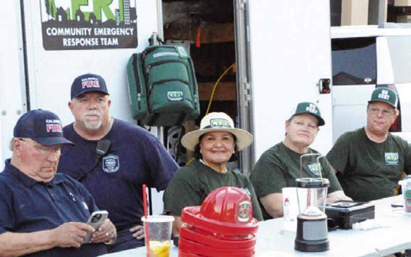 BURLESON COUNTY COMMUNITY Emergency Response Team (CERT) provided First Aid and sold drinks at Saturday night’s Main Street Caldwell Summer Concert Series event. CERT provides individuals with the basic skills they will need in the event of a major emergency or disaster and assists first responders. Members of the Caldwell Fire Department are also pictured.