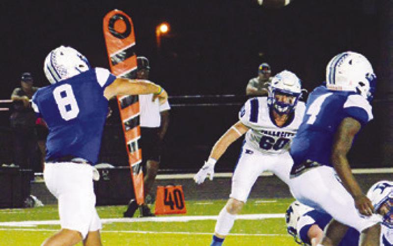 JACOB CAST ANEDA OF Snook hurls this pass last Friday against Falls City in Snook. Snook lost 28-0 and will face Yorktown this Friday in Yorktown. -- Tribune photo by Kim Hutcheson