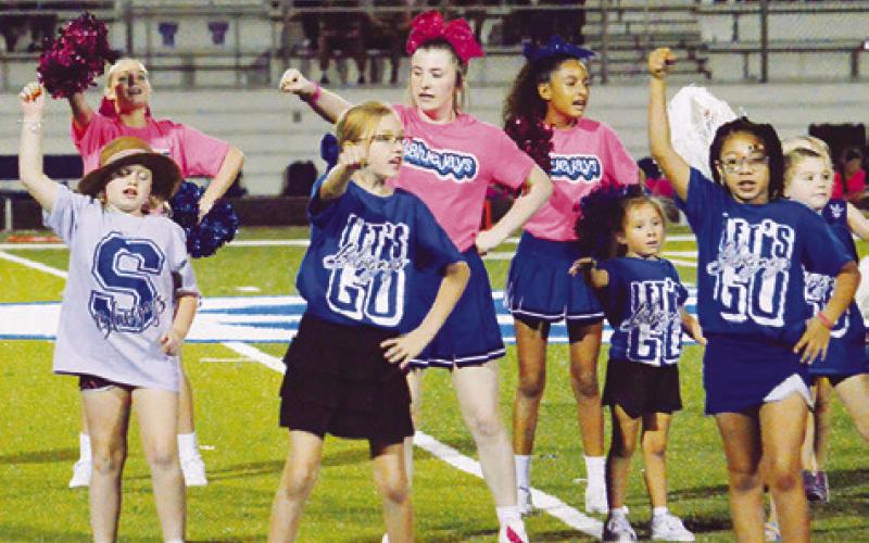 SNOOK HIGH SCHOOL CHEERLEADERS and future cheerleaders entertained the crowd at last Friday’s Snook-Falls City football game.