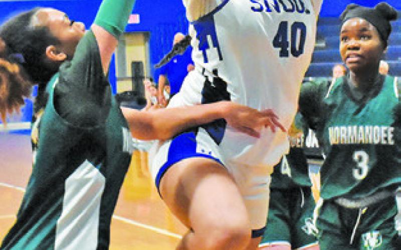 SNOOK’S KARLA LARA takes a jump shot over a Normangee player during Snook’s 50-34 win last Friday evening in Snook. Tribune photo by Roy Sanders