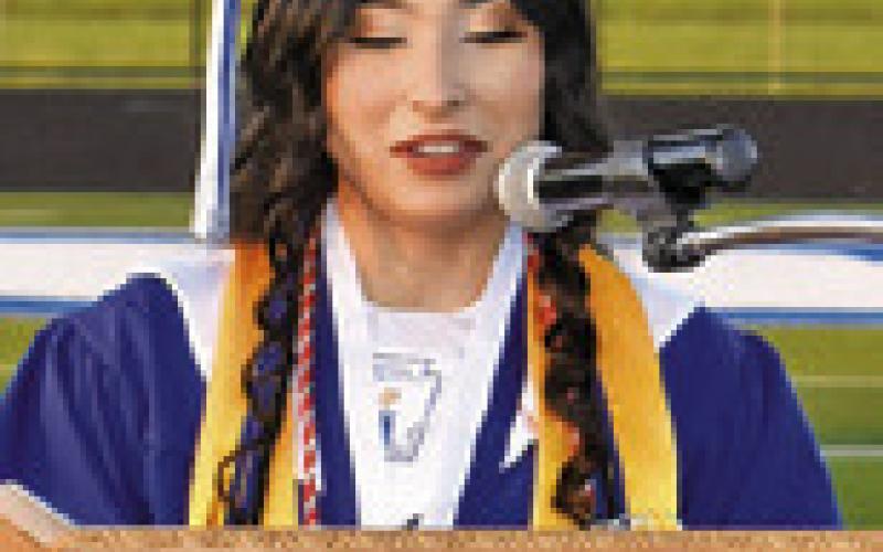 YARETZY CARRIZALES, Snook High School valedictorian, addresses the crowd at the Friday commencement ceremony.