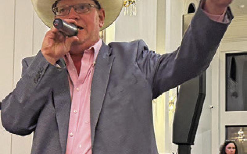 JOHN GRANGE acts as auctioneer at last Thursday’s Burleson County Chamber of Commerce Banquet at The Novo in Caldwell. Tribune photo by Denise Squier