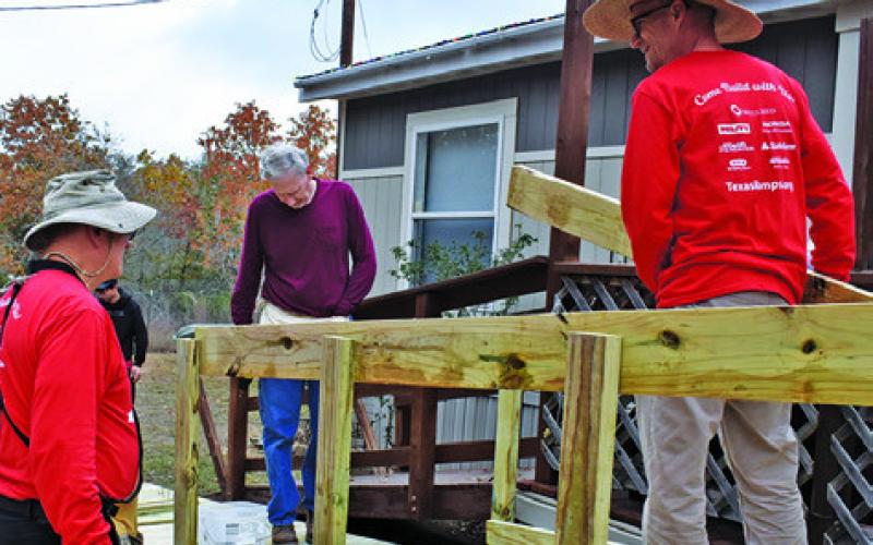 VOLUNTEERS WITH THE Texas Ramp Project, including Caldwell Lions Club members, work on this ramp off Park Road 57.