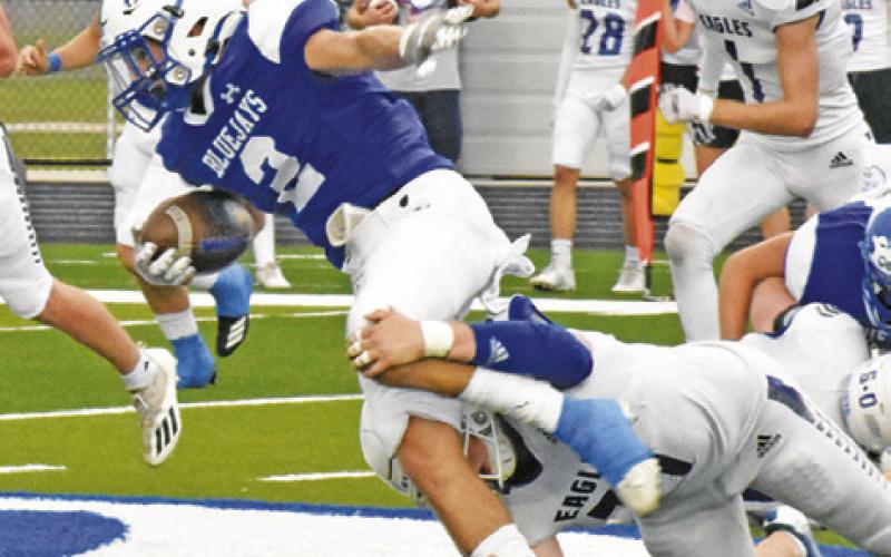 LANCE LARA OF Snook carries the ball against Brazos Christian last Friday in Snook. -- Tribune photo by Roy Sanders