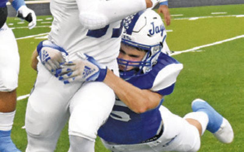 SNOOK’S JOSH GREEN makes a tackle against Brazos Christian School.