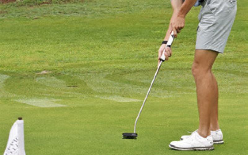BRETT WITHEM of Snook works on putting.