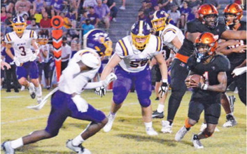 SOMERVILLE’S HERSCHEL CONWAY carries the ball against Weimar last Friday in Somerville. -- Tribune photo by Roy Sanders