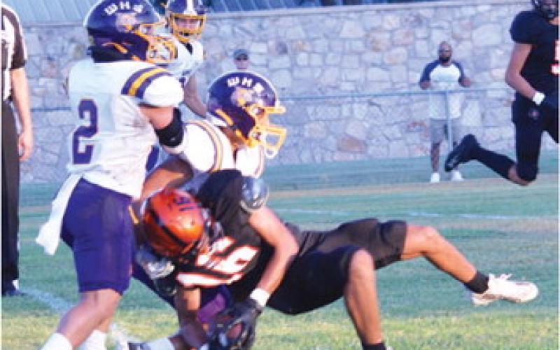 GARDNER SHIVERS MAKES a catch and dives for yardage last Friday against Weimar. -- Tribune photo by Roy Sanders