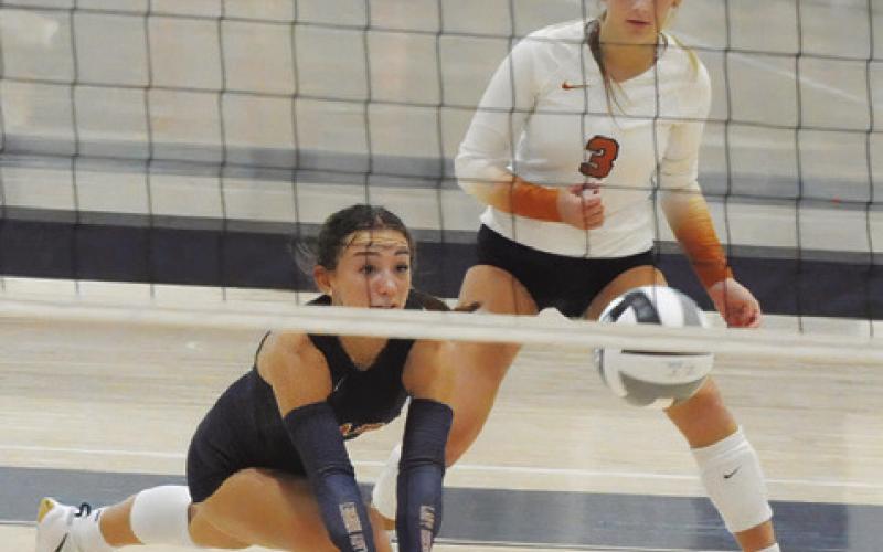 CALDWELL’S NATALIE EASTEPP lunges to get to the ball during Caldwell’s match against Klein Oak at last week’s Legends Invitational tournament in Bryan. Tribune photo by Denise Squier