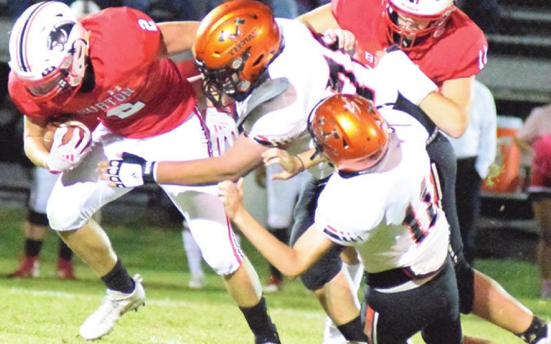 SOMERVILLE’S CEDRIC HUDGEN reaches to tackle Burton’s Tanner Gore while Somerville’s Kutter Rohrbach tries to assist during the Yegua-Panther game last Friday. -- Tribune photo by Denise Squier