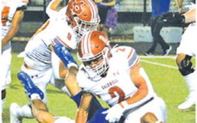 BLANE GARZA OF Caldwell makes a tackle last Friday against the Jarrell Cougars. -- Tribune photo by Kim Hutcheson