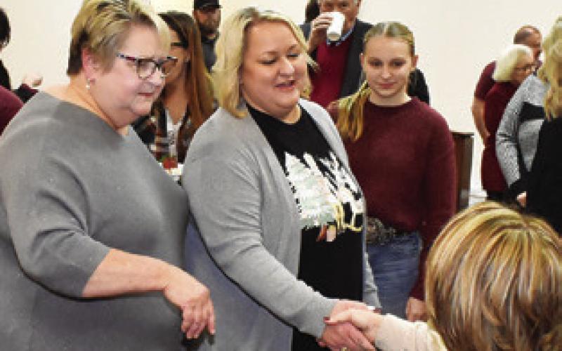 JUDGE REVA TOWSLEE Corbett greets visitors with her daughter Kara Mantey. Numerous well-wishers attended the reception.
