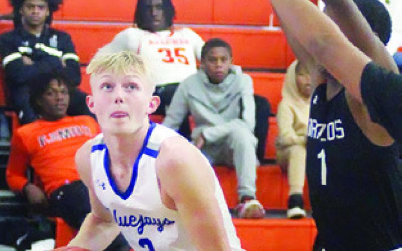 LIAM ZEQUEIRA of Snook prepares to shoot against the Brazos Cougars in the Schulenburg Tournament. -- Photo by Darrell Vyvjala of the Schulenburg Sticker
