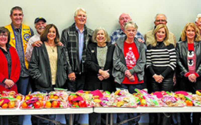 THE CALDWELL MEN’S LIONS CLUB held its Christmas dinner, inviting spouses and significant others, and then wrapping cookie and fruit plates to hand out to widows and widowers in the area. At the event, the club prepared 32 plates.