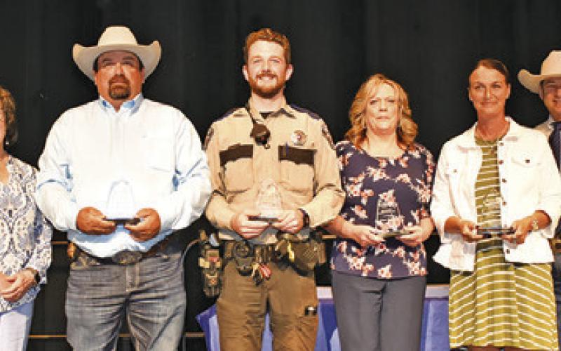 BURLESON COUNTY LAW OFFICER award winners included, third from the left, Chad Elkins, Steven O’Shaughnessy, Ginger Rogers and Nicole Colley. Joining them were, far left, Rotary Incoming President Tracy Pieper and President Lia Zaccagnino, and far right, Sheriff Bill Rios and DPS Sgt. Justin Stohler.