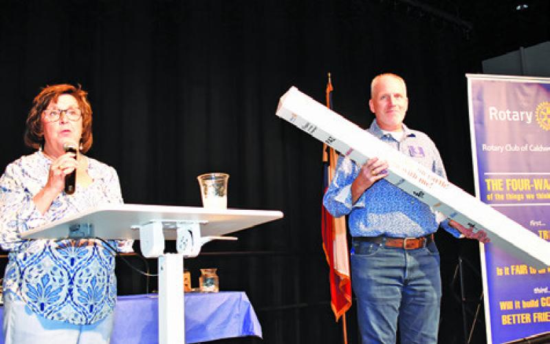 ROTARY PRESIDENT LIA Zaccagnino and Rotarian Kavon Novak display this Rotary Peace Pole.